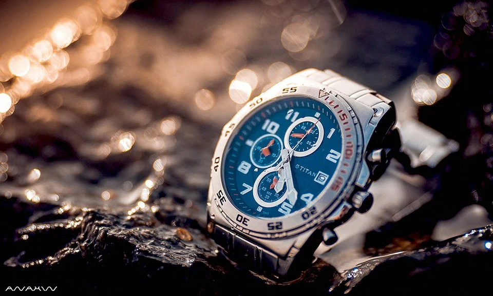 Silver watch wet rocks