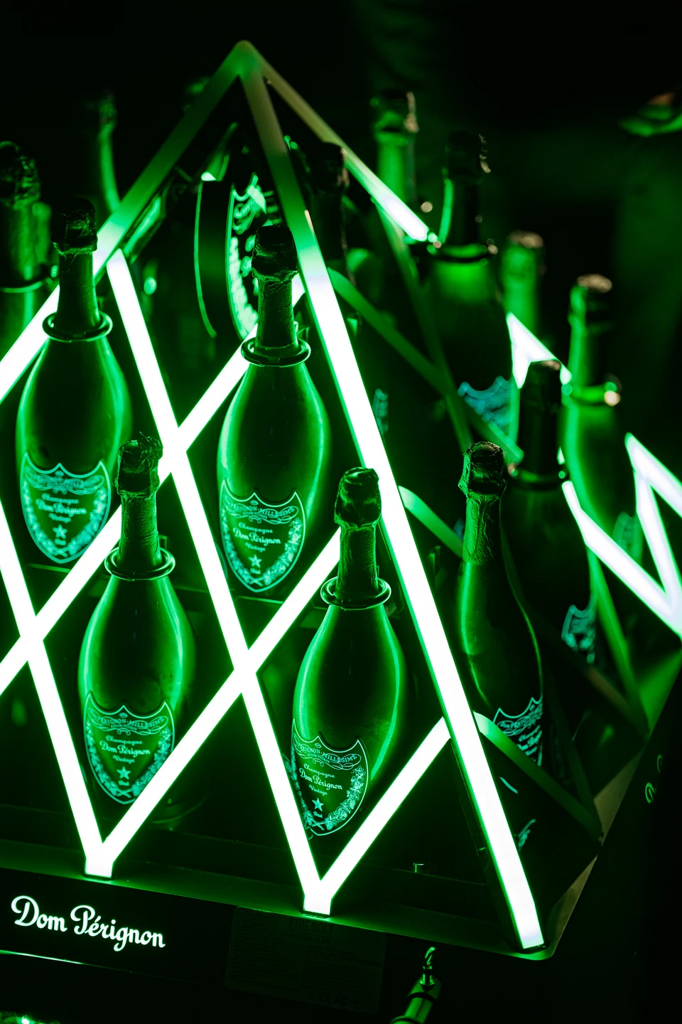 Champagne display green neon triangles