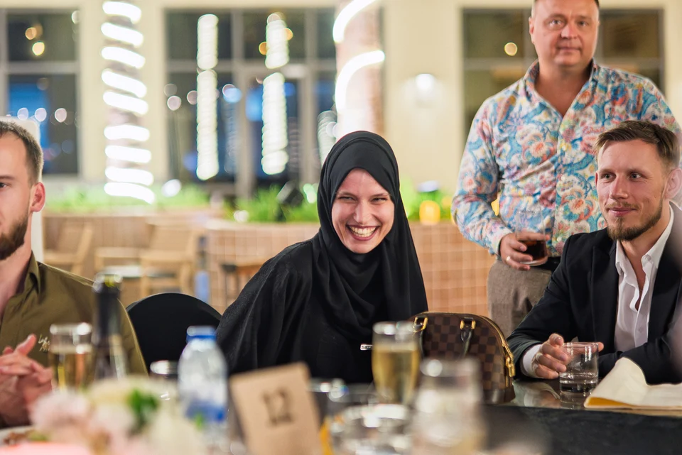 Smiling guests at awards table