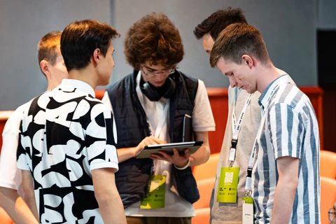 Small group discussing tablet