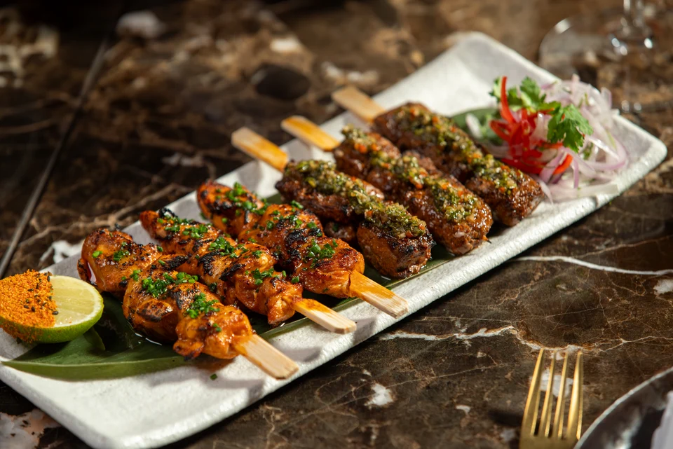 Grilled skewers on long platter