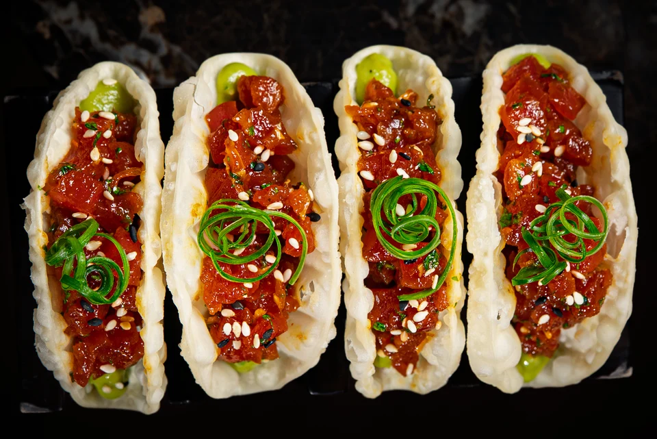 Four tacos in overhead row