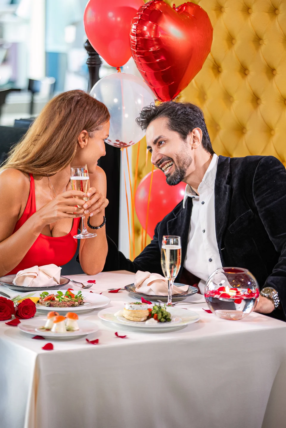 Laughing couple romantic restaurant dinner