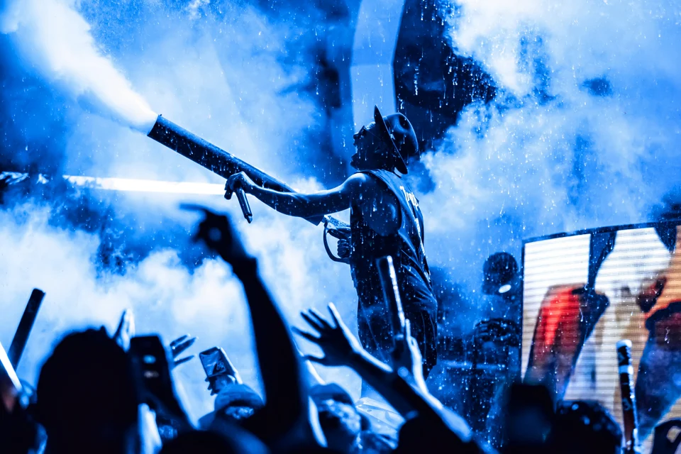 Blue lit performer smoke cannon