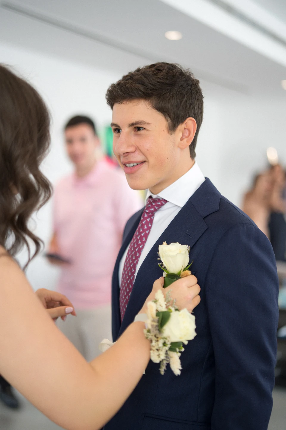 Corsage adjustment smiling formal guest
