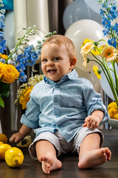 Child seated floral birthday table