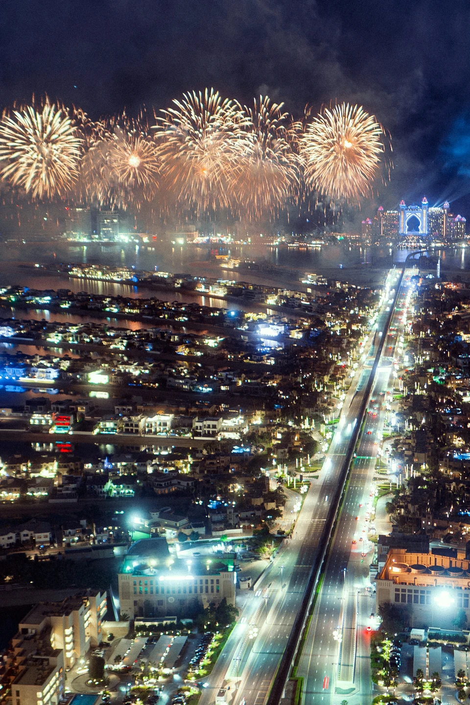 Fireworks above night city avenue