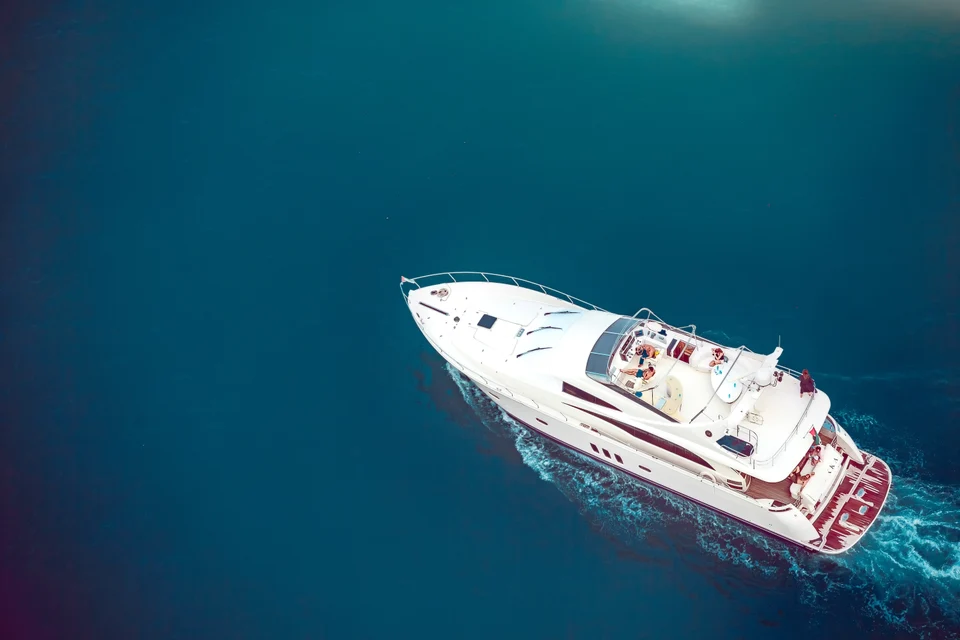 White yacht on deep turquoise water